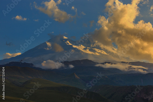 Mount Elbrus during sunset in the rays of the sun. Close-up of a mountain range in the North Caucasus in Russia.