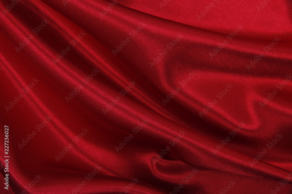 Obraz premium Smooth elegant red silk or satin luxury cloth texture as abstract background. Luxurious valentines day background design