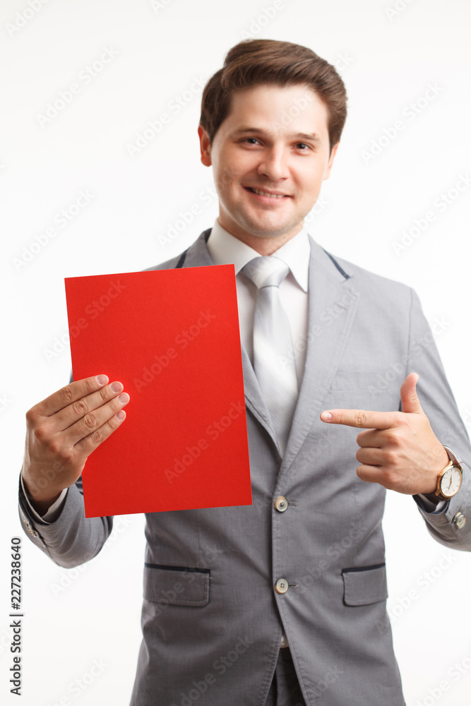 Businessman showing signboard. In studio on a white background Businessman showing signboard. In studio on a white background