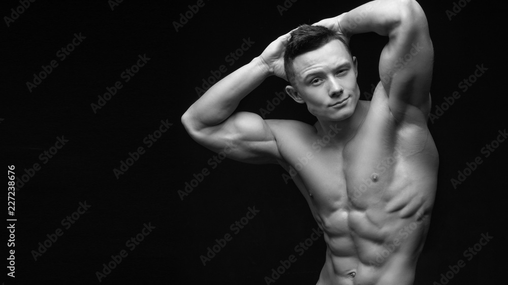 Isolated black and white muscle man with a perfect abs. Isolated black and white muscle man with a perfect abs.