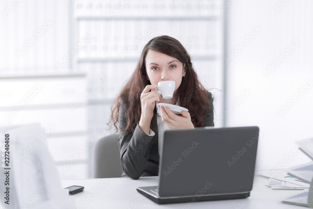 young business woman with Cup of coffee in a work break young business woman with Cup of coffee in a work break