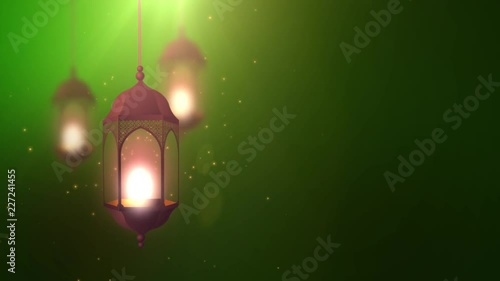 Ramadan candle lantern falling down hanging on string green background