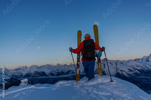 Skitouring with amazing view of swiss famous mountains in beautiful winter powder snow of Alps.