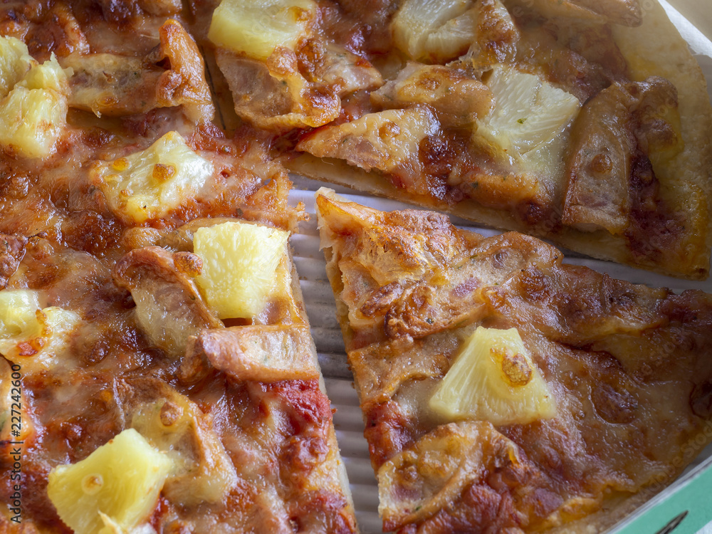 Top view of thin and crispy Pizza in a delivery cardboard box. Top view of thin and crispy Pizza in a delivery cardboard box.