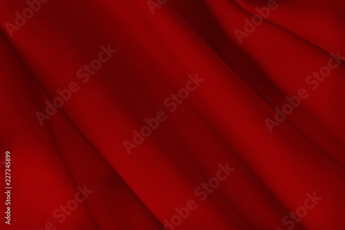 Red fabric texture for background and design art work, beautiful pattern of silk or linen.