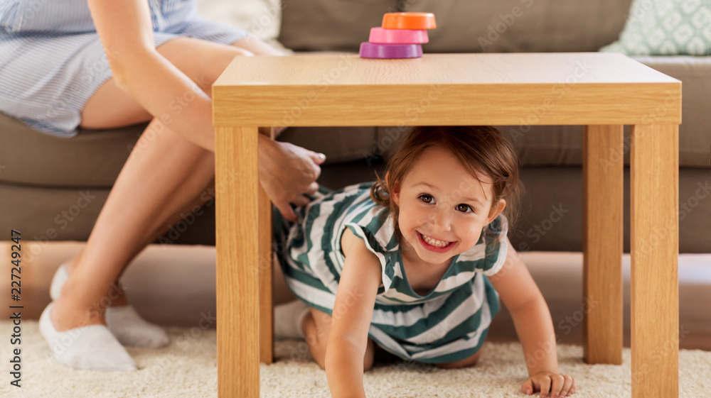 childhood and happiness concept - happy little girl playing at home childhood and happiness concept - happy little girl playing at home
