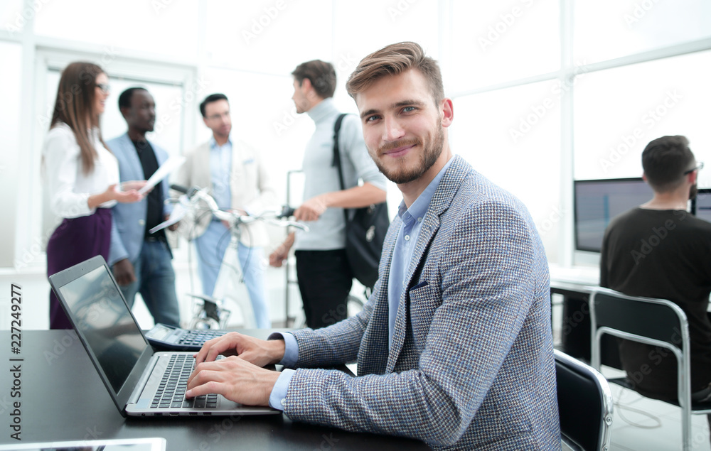 programmer is testing the laptop in the office programmer is testing the laptop in the office