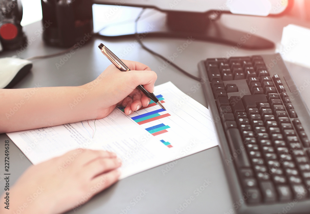 Business Woman Writing with pen the office Business Woman Writing with pen the office