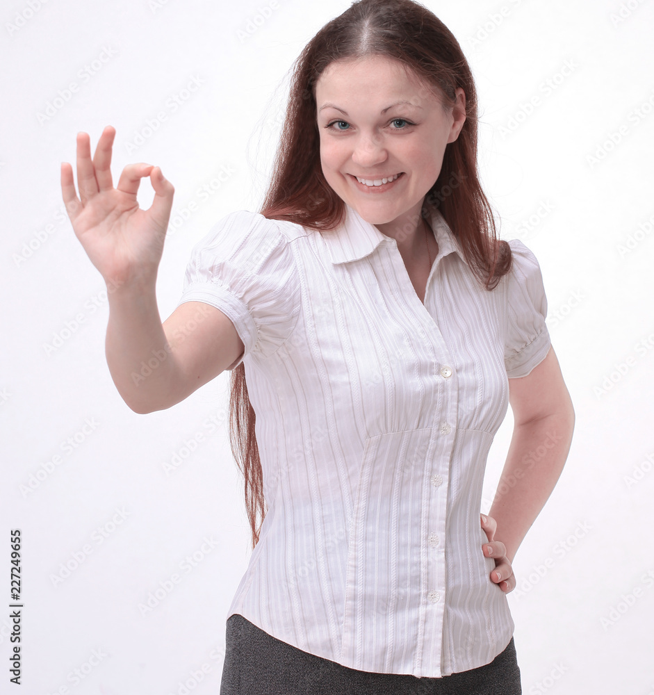successful modern girl showing okay gesture.isolated on white. successful modern girl showing okay gesture.isolated on white.