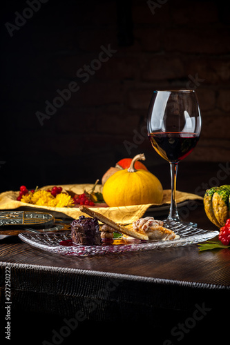 Deer steak on a black background. A Halloween Meal.