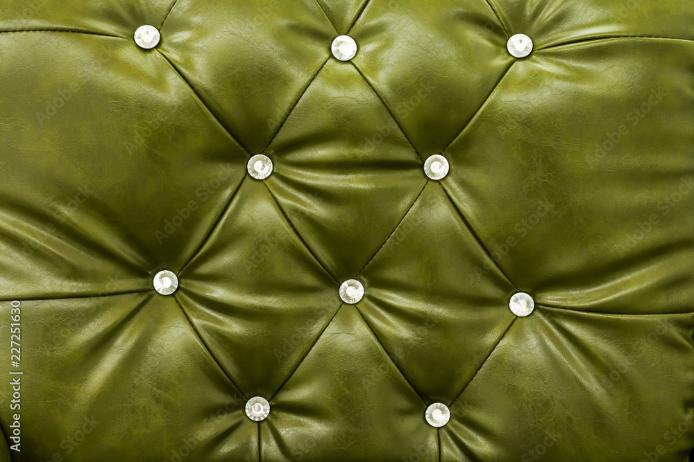 Fototapeta premium Green leather sofa texture background.