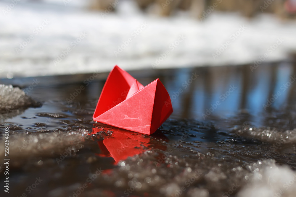paper boat in a pool