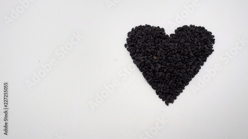 Black sesame seeds on white background.It is asian food. photo