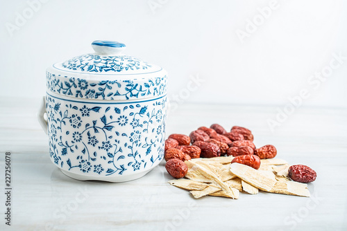 Chinese health soup - Huangqi red dates stewed black chicken photo