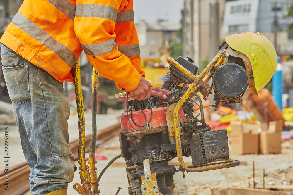 Construction worker welding iron train tracks. Construction worker welding iron train tracks.