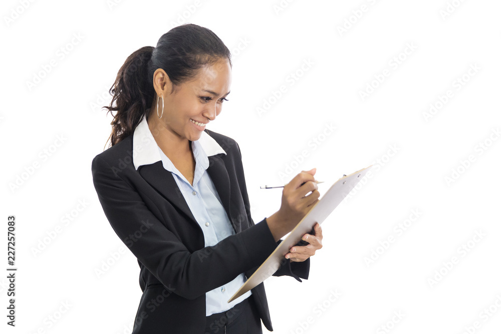 young busineswoman writing report while standing young busineswoman writing report while standing