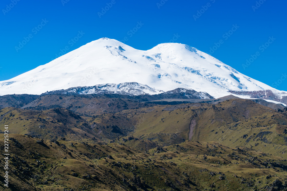 Fototapeta premium Beautifull landscape view of the mount Elbrus - the highest mountain in Europe. Caucasus mountains at autumn season time.