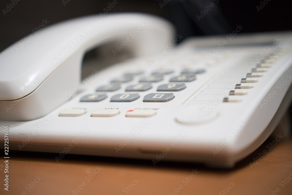 close up soft focus on telephone devices at office desk for customer service support concept close up soft focus on telephone devices at office desk for customer service support concept