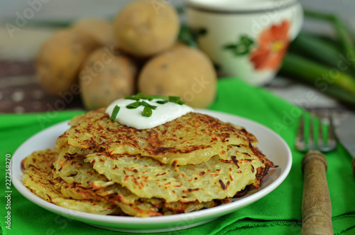 Homemade potato pancakes with sour cream