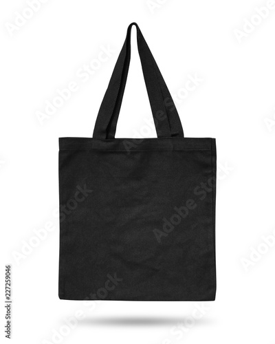 Black fabric bag isolated on white background. Cloth handbag for your design. Recycled material. Clipping paths object.