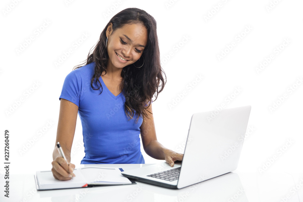 beautiful casual college student writing on a notebook while bro beautiful casual college student writing on a notebook while bro