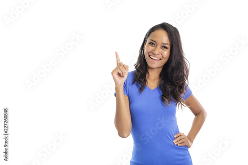 casual college student smiling while pointing above like having 