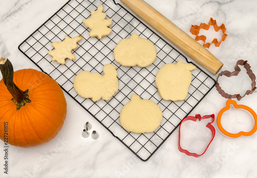 Top view baking for fall celebrations.  Holiday cookies background with cutters and rolling pins.