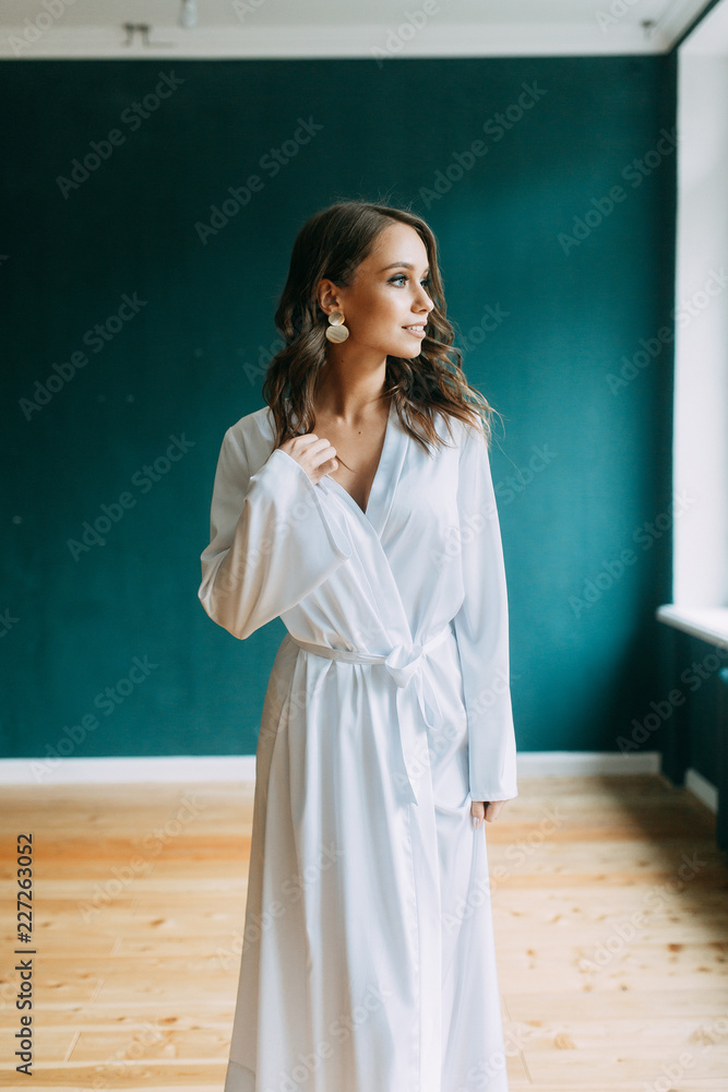Conceptual wedding, the morning of the bride in the European style. Boudoir dress and a bouquet of flowers, fees in the interior Studio. Conceptual wedding, the morning of the bride in the European style. Boudoir dress and a bouquet of flowers, fees in the interior Studio.