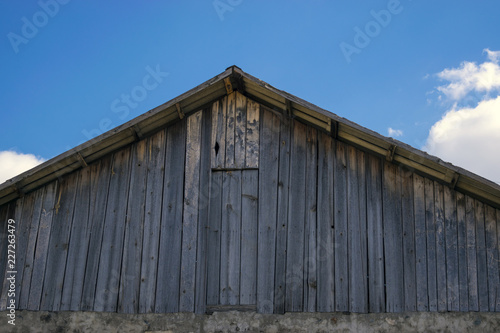 Old farm roof and blue sky