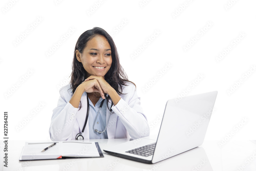 asian young doctor smiling while sitting on her workspace and l asian young doctor smiling while sitting on her workspace and l
