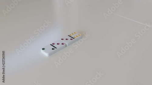 Putting third domino into line