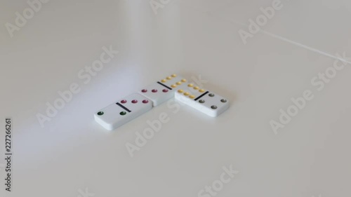 Putting fourth domino into line