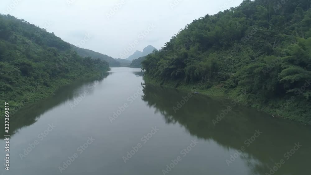 Aerial drone view of Chiang Rai area with beautiful mountains and river landscape during foggy morning, Thailand Aerial drone view of Chiang Rai area with beautiful mountains and river landscape during foggy morning, Thailand