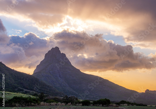 Sunset beautiful Mauritius paradise landscape. Mauritius nature view of colorful sky and light of sun. Mountains with trees near Port Louis, Mauritius.