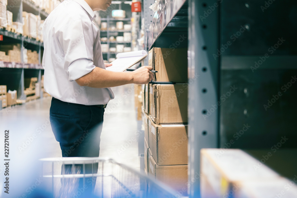 Man warehouse worker checking goods at warehouse. Man warehouse worker checking goods at warehouse.