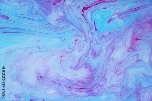 Abstract colored marble background. Stains of paint on the water.