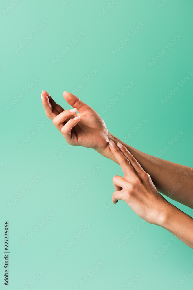 cropped shot of person checking pulse isolated on green cropped shot of person checking pulse isolated on green