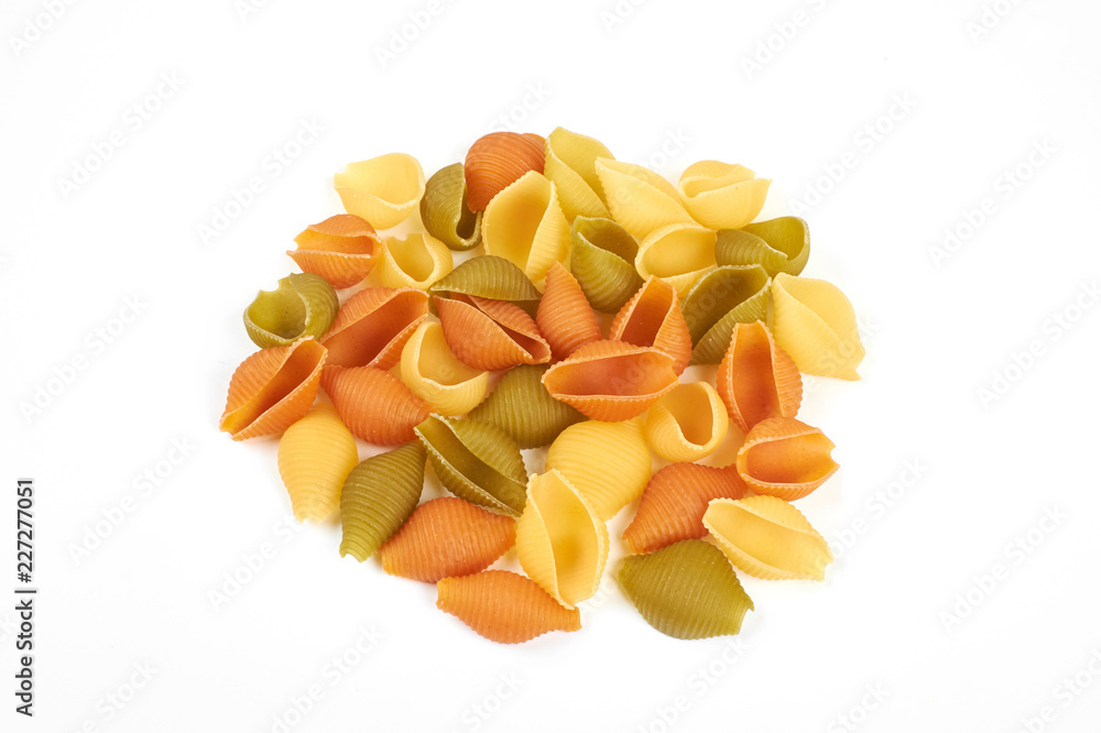 conchiglie paste of different colors isolated on white background conchiglie paste of different colors isolated on white background