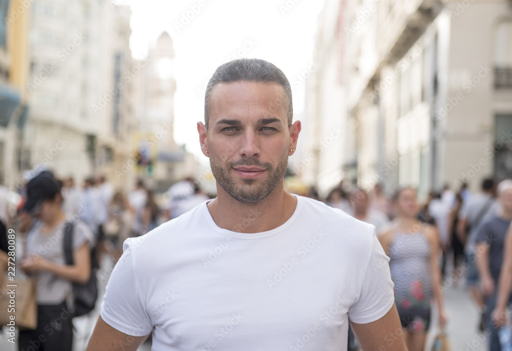 Handsome man posing in the center of the city Handsome man posing in the center of the city