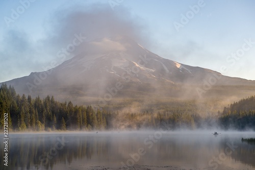 Fototapeta Naklejka Na Ścianę i Meble -  Fishermen on a beautiful misty morning at Mount Hood