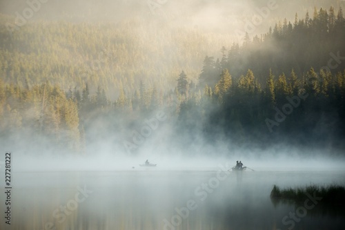 Fishermen on a beautiful misty morning at Mount Hood