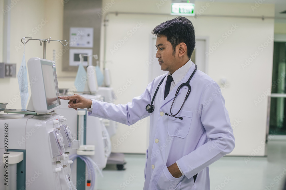 he doctor using the ultrasonography device. he doctor using the ultrasonography device.