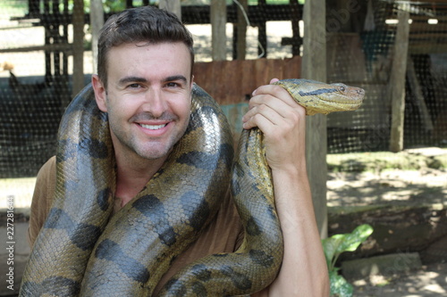 Man loving his gorgeous Anaconda 