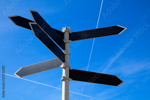 Empty guidepost with arrow shaped labels