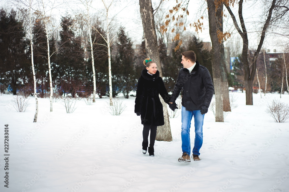 couple in love in the winter forest