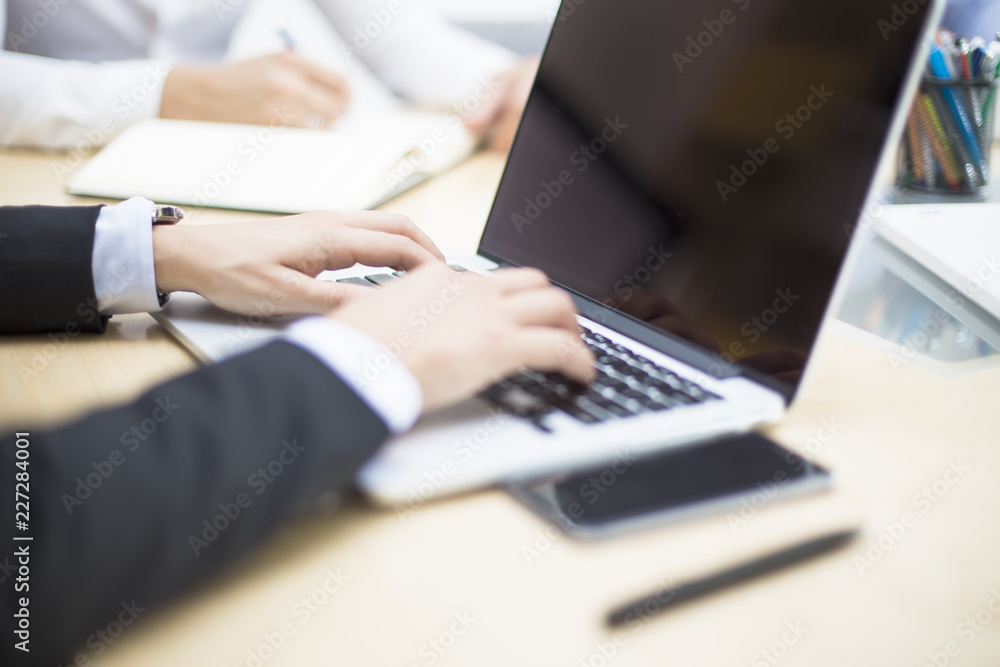 Businessman working on laptop in the office Businessman working on laptop in the office