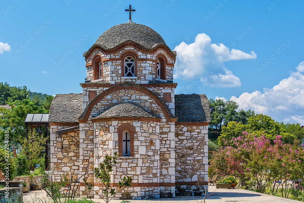 Fototapeta premium Olympiada, Greece - August 18, 2018: St. Nicholas church at the beach of the town Olympiada in Chalkidiki in Greece
