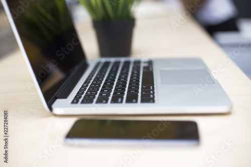 Laptop and mobile phone on ...