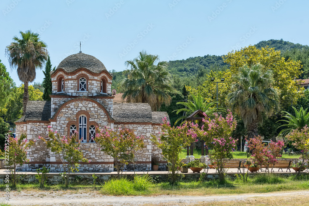 Fototapeta premium Olympiada, Greece - August 18, 2018: St. Nicholas church at the beach of the town Olympiada in Chalkidiki in Greece
