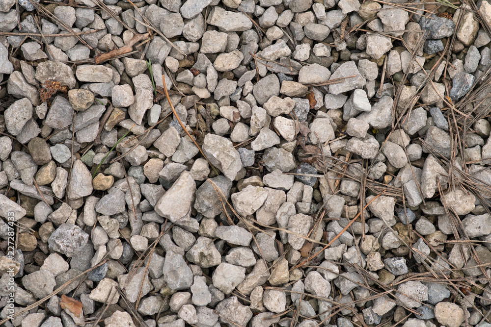 Grey rough pebble background Grey rough pebble background